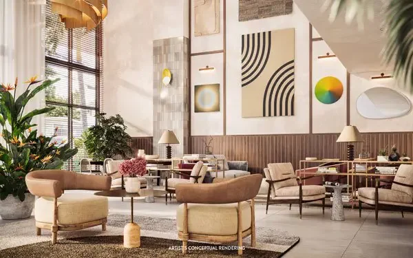 Lobby de doble altura con ventanales de piso a techo
